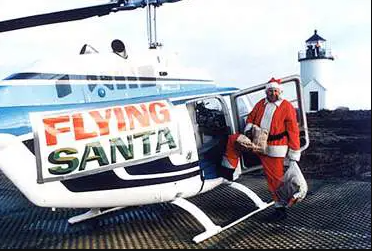 Flying Santa Edward Snow in 1978 with his helicopter.