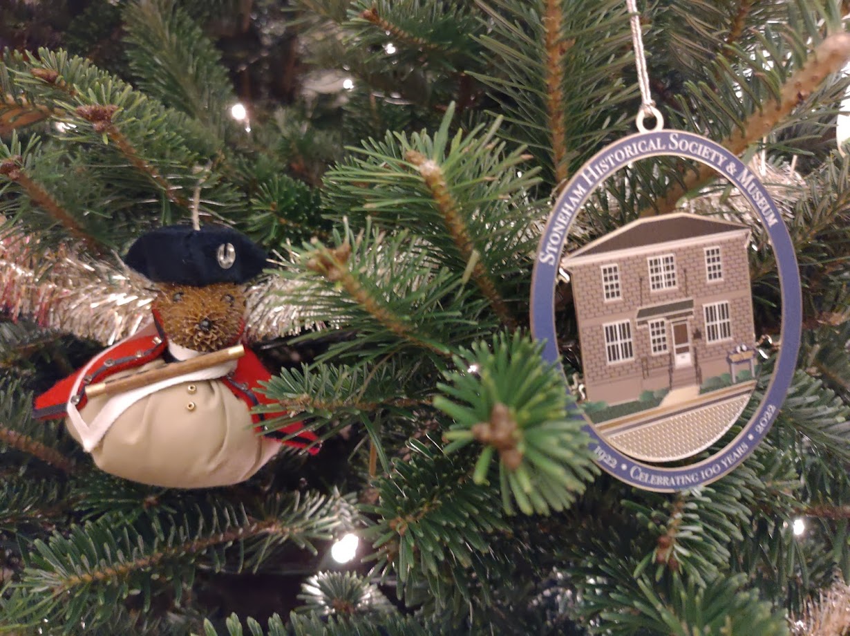 Christmas tree showing a stuff "minuteman" ornament and a Stoneham Historical Society ornament